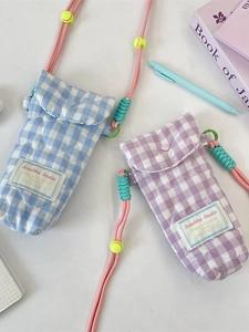 Quilted cotton crossbody camera bags in blue and purple with heart buttons and woven straps