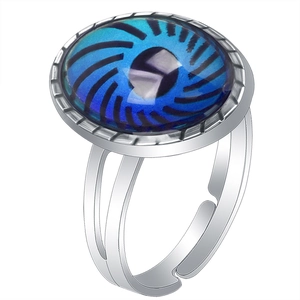 Detailed shot of an adjustable silver ring featuring a round blue color-changing gemstone