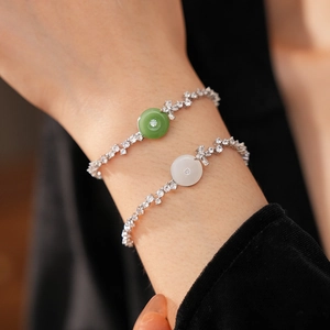 Detail of green and white chalcedony bracelets with pavé zircons on silver chain