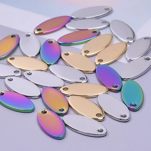 Flat oval stainless steel pendants in silver, gold, and iridescent rainbow colors
