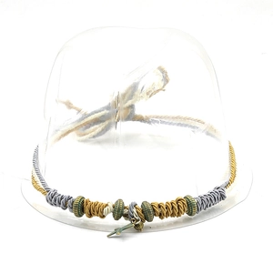 Hand-woven bohemian style cord necklace featuring bronze rings and branch pendant