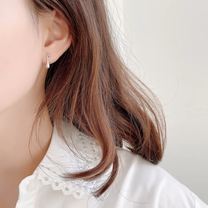 Minimalist 925 sterling silver teardrop stud earrings worn by model with lace outfit