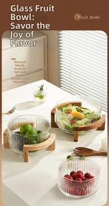 Soda-lime glass fruit bowl with vertical stripes and a cross-shaped natural wooden base
