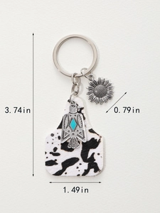 Detailed view of Western style cow print keychain with dimensions and sunflower charm