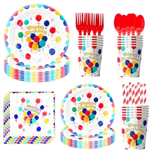 Detailed set of Happy Birthday party tableware with balloon prints and red cutlery