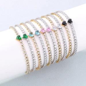 Detail view of heart-shaped colorful zircon tennis bracelets in gold and silver plating