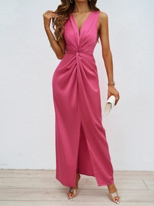 Detail of rose pink satin maxi dress featuring elegant twist waist and high front slit