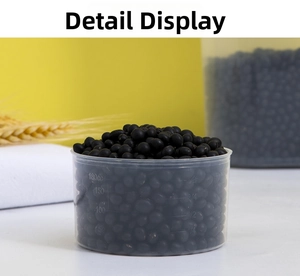 Detailed view of 180cc measuring cup filled with black beans and molded scale lines