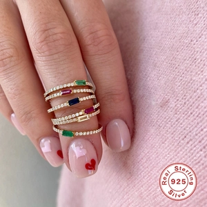 S925 Sterling Silver stacking rings with colorful gems in gold finish on hand