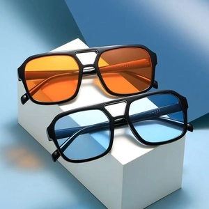 Retro double-bridge pilot sunglasses in bright orange and light blue with black frames
