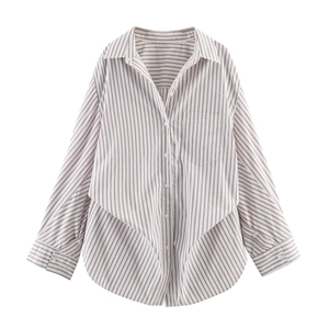 Detail of striped long sleeve shirt showing button closure and irregular layered hemline
