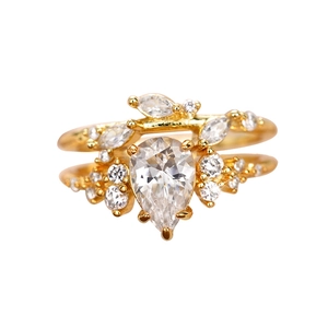 Elegant gold leaf ring set with pear-cut crystal and marquise zircon accents