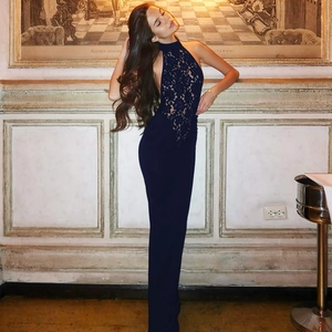 Deep blue lace halter neck evening gown with backless detail and slim fit mermaid silhouette