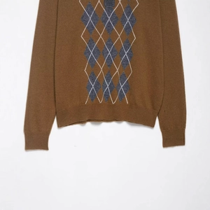 Classic men's brown knit polo sweater with argyle pattern on a clean white background