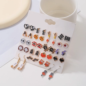 Detailed view of Halloween earring set featuring pumpkins, ghosts, and spiders on white card
