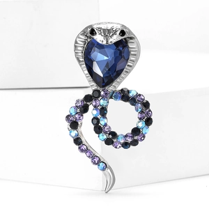 Sparkling cobra snake brooch with blue heart gem and gradient crystals on silver metal