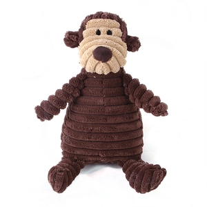 Detailed close-up of brown corduroy plush dog toy in a cute monkey shape with soft texture