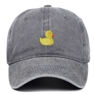 Close-up of cute yellow duck embroidery on a vintage washed grey cotton baseball cap