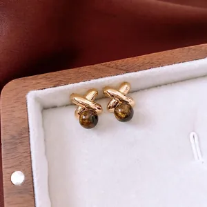 Minimalist 18k gold plated X-shaped stud earrings with dark brown tiger eye stone beads