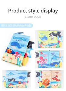 Detail view of marine soft book showing interactive 3D animal tails and bilingual text