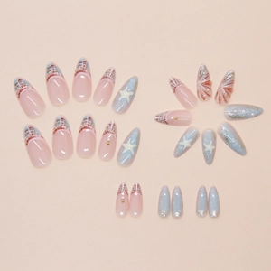 Detail of blue sea-themed almond press-on nails with 3D starfish and pearl accents