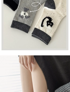 Detailed knit texture of mid-calf socks featuring cute cartoon jacquard animal patterns