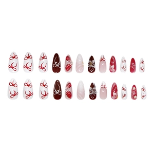 24pcs almond press-on nails with 3D floral designs and red bow tie accents