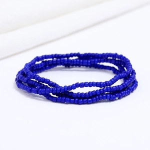 Detail of multi-layer handmade blue beaded waist chain with vibrant glass seed beads