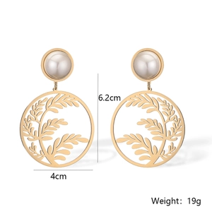 Detailed view of gold leaf earrings with pearls showing dimensions 6.2cm by 4cm