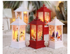 Close-up of decorative Christmas lanterns featuring festive Santa and Snowman illustrations