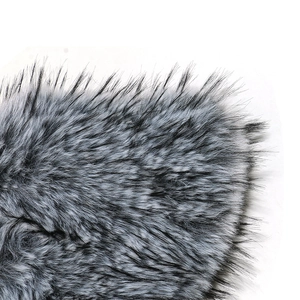 Detailed macro shot showing black and grey gradient faux fox fur texture and fibers