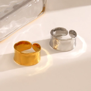 Minimalist wide band open rings in gold and silver with irregular hammered texture