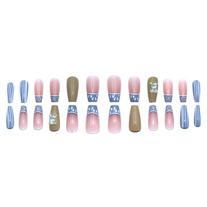 Press-on nails featuring 3D bears, hearts, cream contrast colors, and French blue tips set