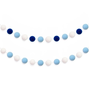 Macro view of blue and white felt ball garland decorations for party wall hanging