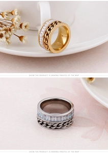 Macro view of chain ring with square-cut cubic zirconia in gold and silver finishes