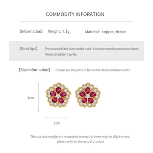 Detailed view of 1cm flower zircon earrings with silver pins and gold plating
