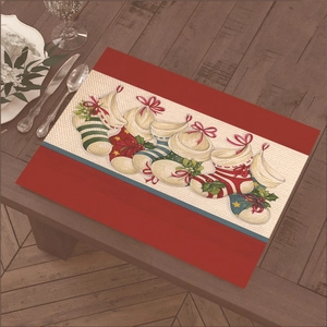 Christmas placemat with snowman and tree pattern on wooden dining table for home decor