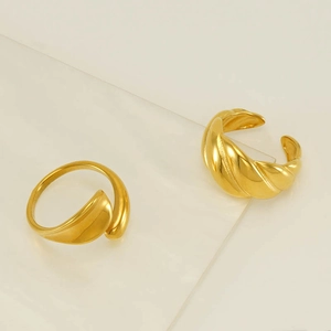 Detail view of 18k gold plated stainless steel streamlined and textured open rings