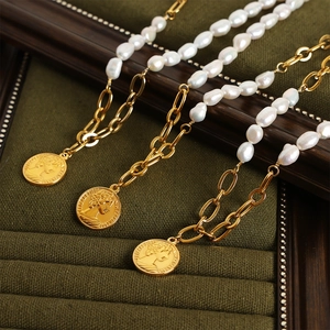 French vintage pearl necklace with gold coin pendant featuring Queen Elizabeth II portrait