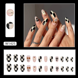 Halloween oval press-on nails set with ghost, pumpkin, and checkered pattern on cream white