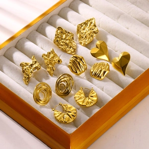Exaggerated golden flower and heart-shaped stainless steel earrings in jewelry box