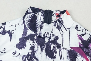 Detail of high stand collar and back zipper on printed white slim-fit bodysuit