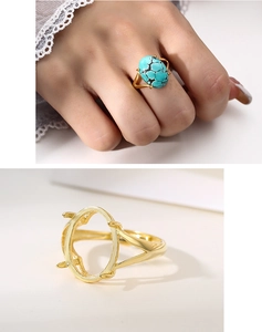 Detailed view of a four-prong gold ring base setting with turquoise gemstone inlay