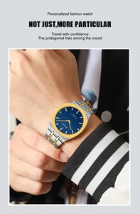 Close-up of golden square quartz watch with blue dial on male wrist in daily life