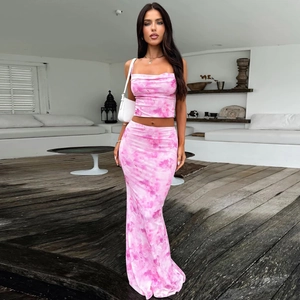 Detail of pink tie-dye two-piece set featuring a crop top and bodycon skirt for summer