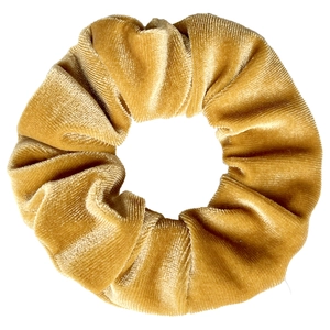 Close-up of golden velvet scrunchie with soft tie-dye texture and rich ruffled detail