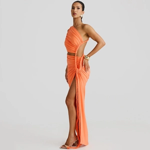 Detail of orange one-shoulder maxi dress featuring side cut-outs and thick rope ties