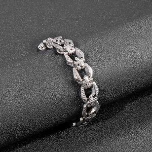 Detailed macro view of punk style stainless steel bracelet with cross motifs on links
