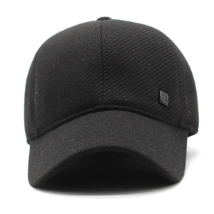 Detail view of the black wool blend baseball cap showing fabric texture and side logo