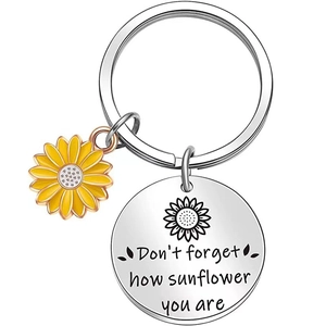 Close-up of stainless steel sunflower keychain with Don't forget how sunflower you are text